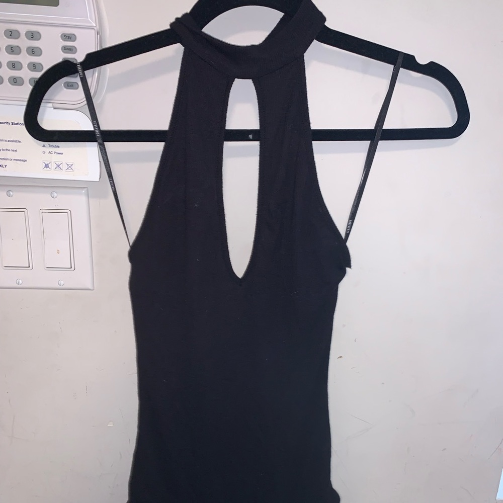 Black ribbed collared bodysuit with snaps.